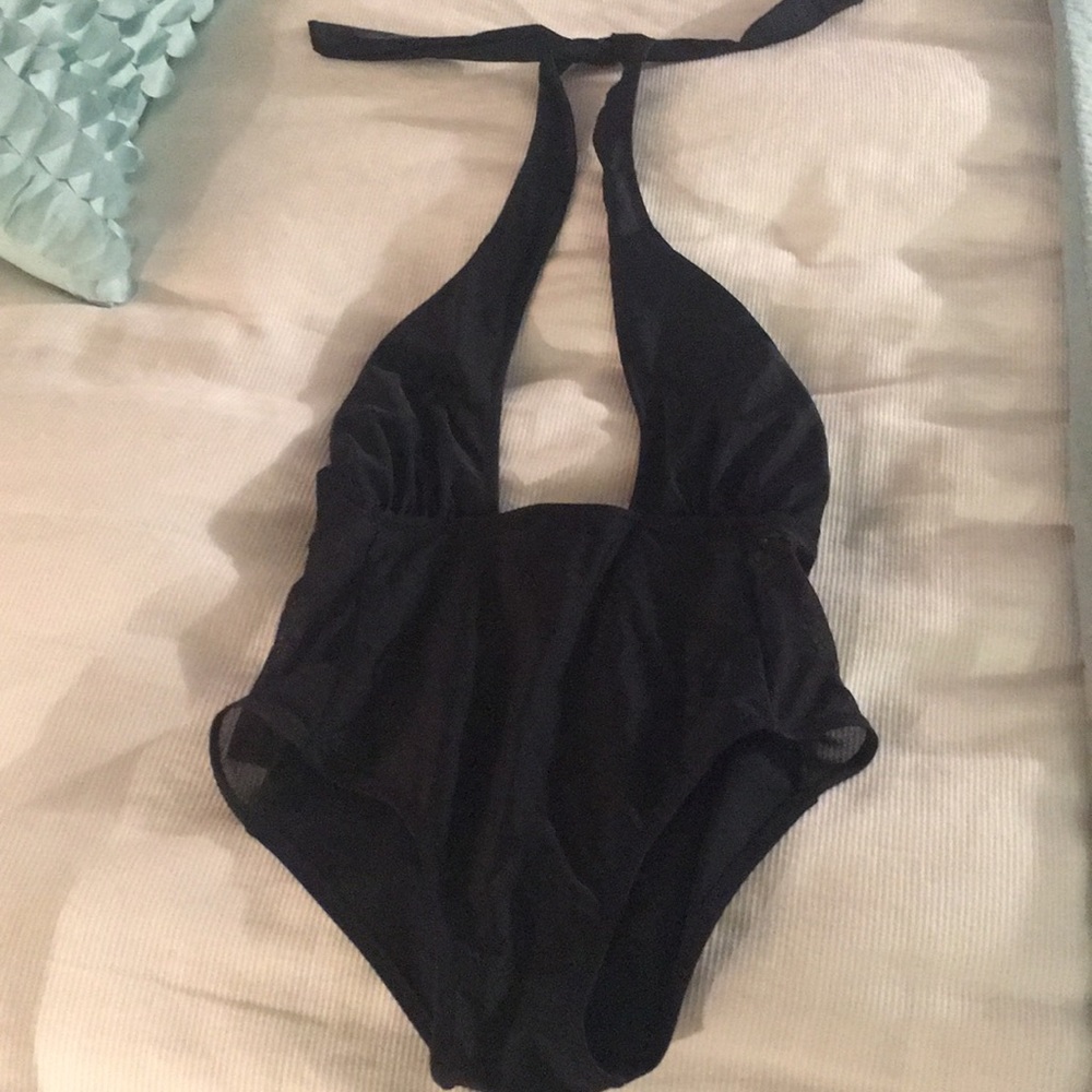 Black low cut bodysuit or bathing suit